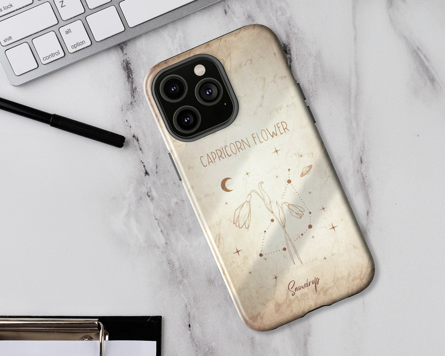 Capricorn Zodiac sign birth month flower in hand-drawn line art on vintage paper iPhone case